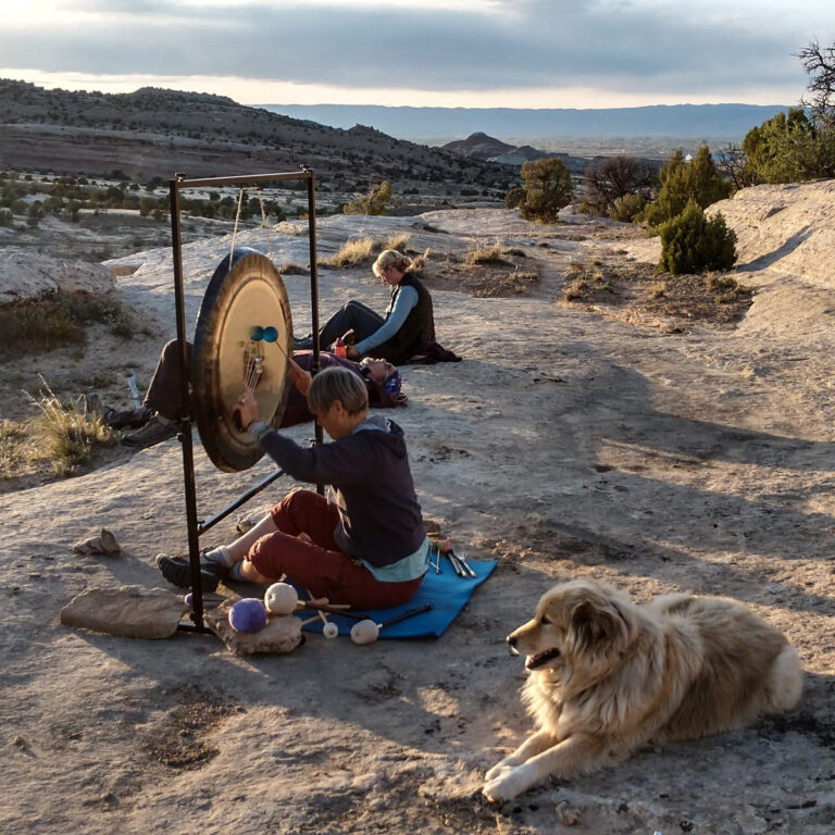 cropped Sacred sound at sunset on the rocks behind the house 768x768